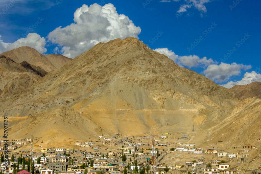 old mountain village under a big mountain