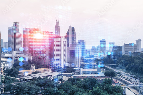 Photography World planet Earth map hologram over panorama city view of Kuala Lumpur, Malaysia, Asia