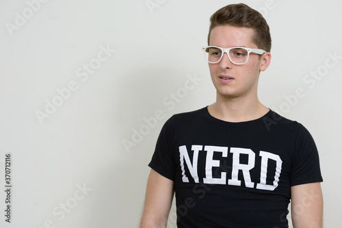 Portrait of young handsome nerd man with eyeglasses © Ranta Images