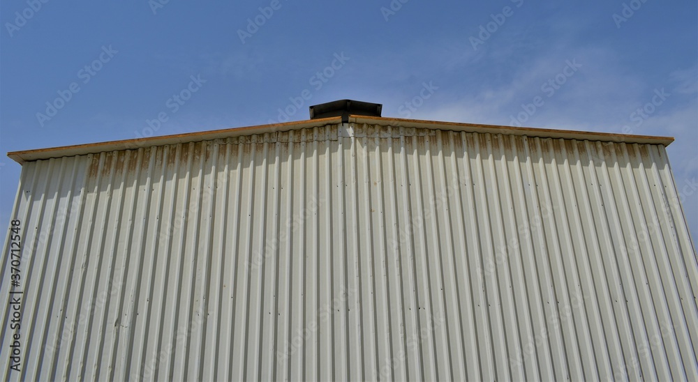outdoor view of Industrial warehouse in the site. Industrial warehouse interior and outdoor of roof ceiling structure. outdoor view of Industrial warehouse in the site. Industrial warehouse interior and outdoor of roof ceiling structure.