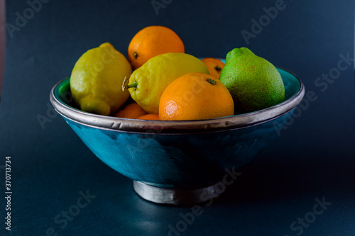 Bowl of fresh fruits  lemon  lime  orange.