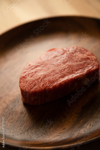 Beef fillet steak on the wooden plate