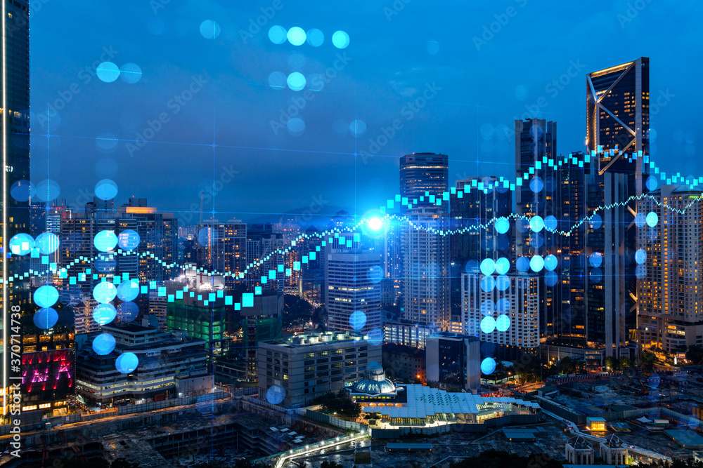 Fototapeta premium FOREX graph hologram, aerial night panoramic cityscape of Kuala Lumpur. KL is the developed location for stock market researchers in Malaysia, Asia. The concept of fundamental analysis.