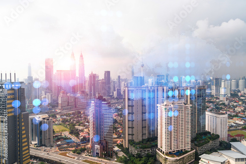 Canvas Print World planet Earth map hologram over panorama city view of Kuala Lumpur, Malaysia, Asia