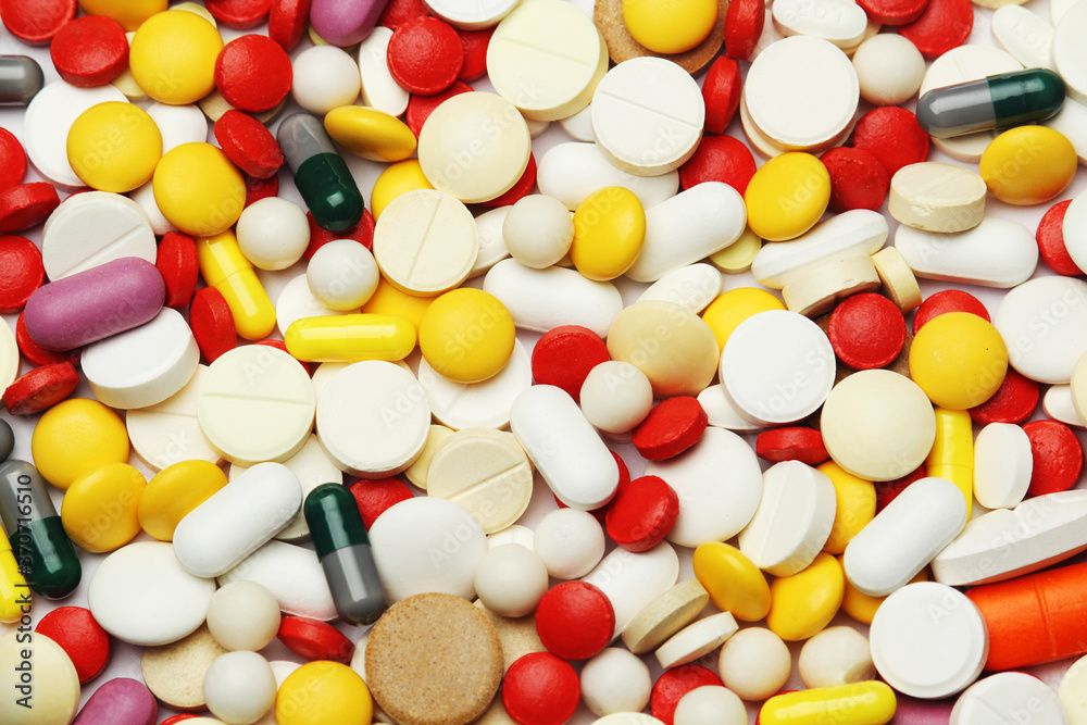 Different colorful tablets at white background Different colorful tablets at white background