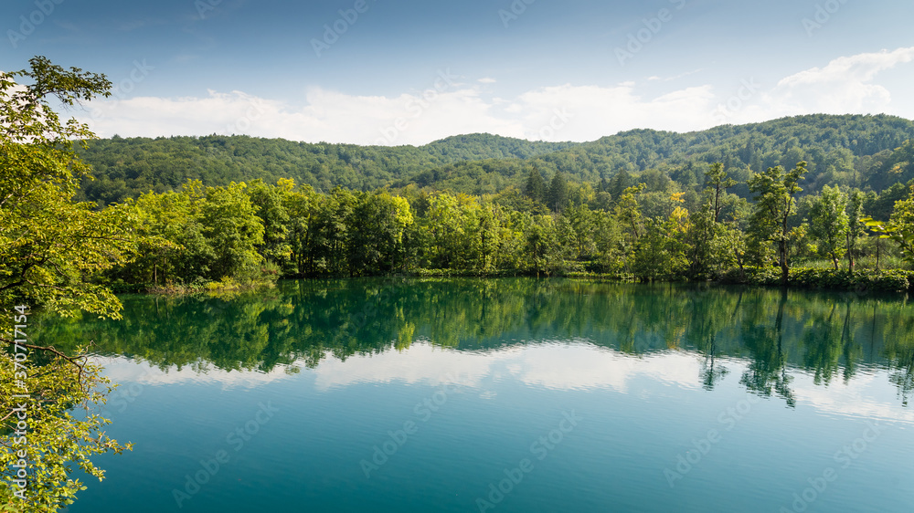 Big lake with crystal clear water in the forest in Plitvice lakes National Park, Croatia. Nature landscape