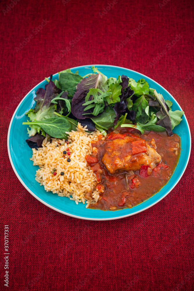 Fototapeta premium Basque Braised Chicken With Peppers and rice