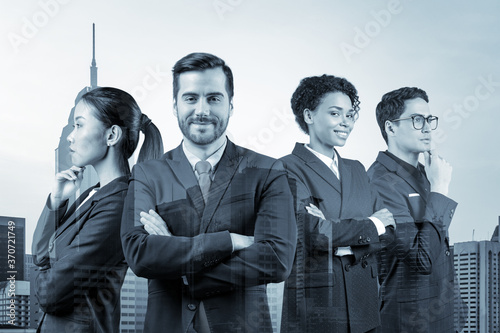 Four successful smiling business consultants standing in a row in suits and ready to tackle with customer problem. Kuala Lumpur cityscape. KL skyscrapers. Double exposure. photo