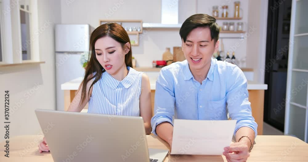 couple discuss finances at home couple discuss finances at home