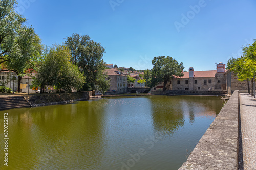 View at the Viseu city downtown, with the Paiva river , classic buildings and Church of Mercy on top