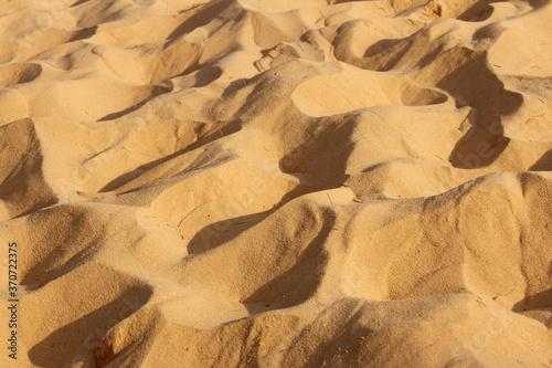 Red Sand Dunes in shadow and sunlight, Mui Ne, Vietnam photo