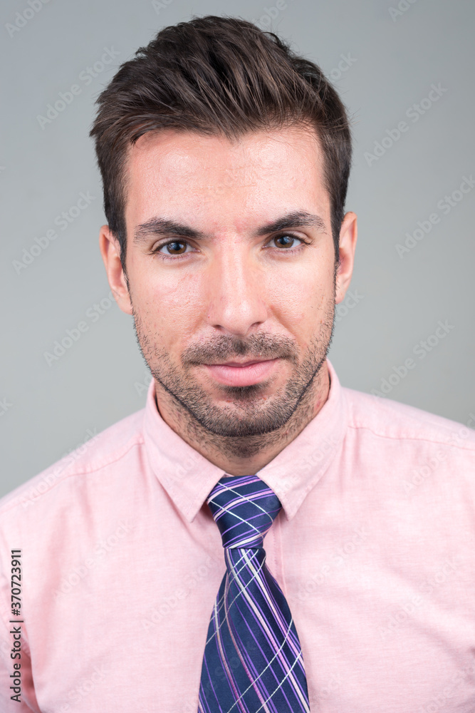 Portrait of young handsome Hispanic businessman against white background Portrait of young handsome Hispanic businessman against white background