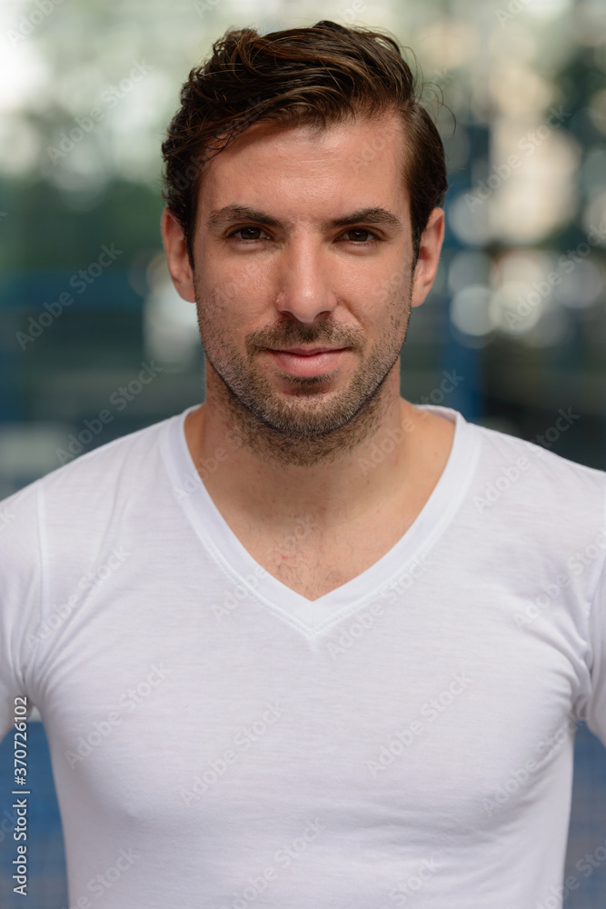 Young handsome Hispanic man at the padel court Young handsome Hispanic man at the padel court