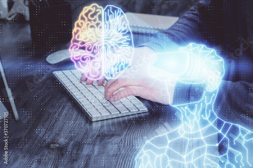 AR hologram with man working on computer on background. Augmented reality concept. Double exposure.