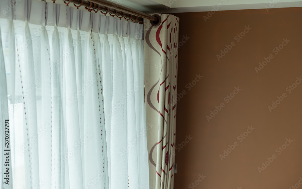 White blinds curtain decoration on the door with copy space.
White blinds curtain decoration on the door with copy space.
