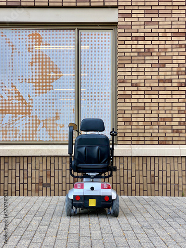 Albert Schweitzer Ziekenhuis, in Dordrecht, South Holland in the Netherlands. Mobility scooter parked outside the physiotherapy center parking area outside the hospital. photo