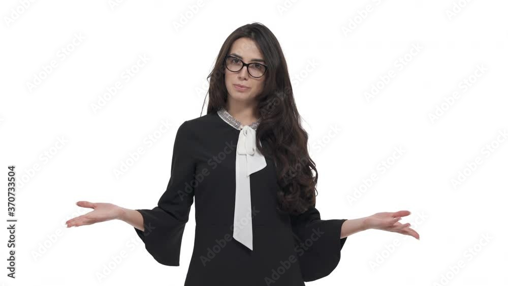 Young Caucasian woman entering in frame. Teacher in glasses giving lesson pointing to different sides. TV presenter telling about weather forecast. Isolated on white background.