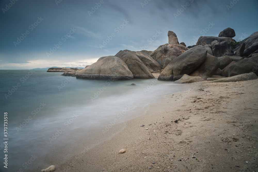 The scenery of the long-exposure of Hinta or Grandfather (Grandpa) rocks of Lamai beach in Samui island, Surat Thani, Thailand. The scenery of the long-exposure of Hinta or Grandfather (Grandpa) rocks of Lamai beach in Samui island, Surat Thani, Thailand.