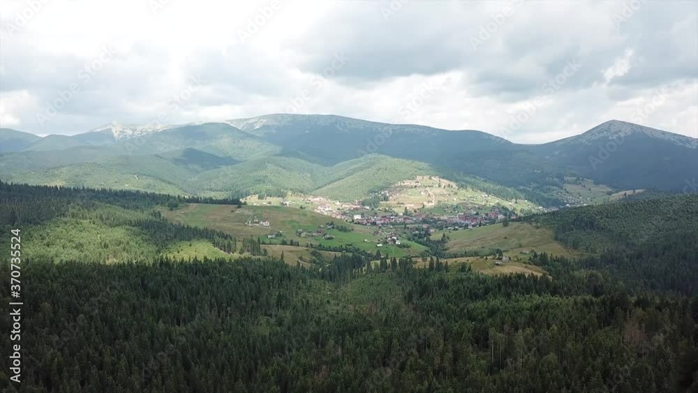 AERIAL view Above the forest trees towards mountains AERIAL view Above the forest trees towards mountains