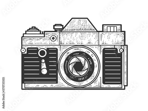 Old photo camera sketch engraving vector illustration. T-shirt apparel print design. Scratch board imitation. Black and white hand drawn image.
