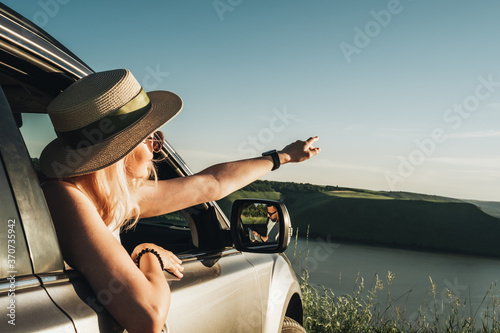Beautiful Traveler Girl Enjoy Road Trip in the Car Near Canyon