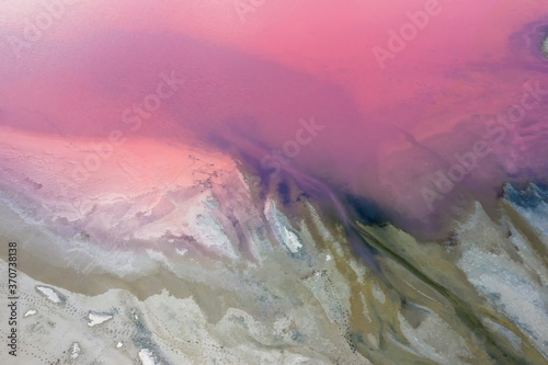 . Aerial view of pink lake and sandy beach. Ukraine