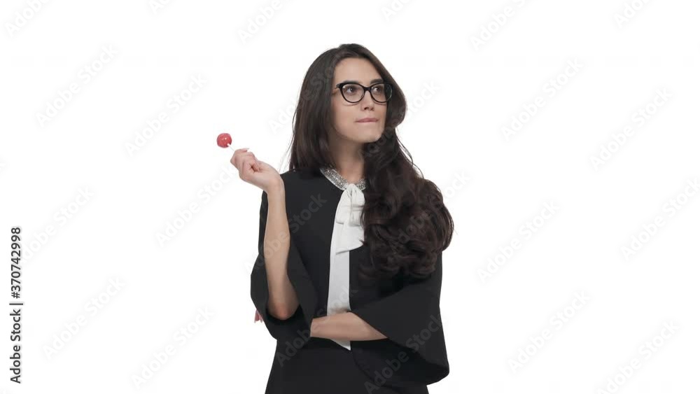 Portrait of young Caucasian woman in glasses with lolly pop. Isolated on white background Portrait of young Caucasian woman in glasses with lolly pop. Isolated on white background