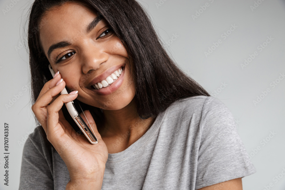 Beautiful african woman talking on cell phone Beautiful african woman talking on cell phone