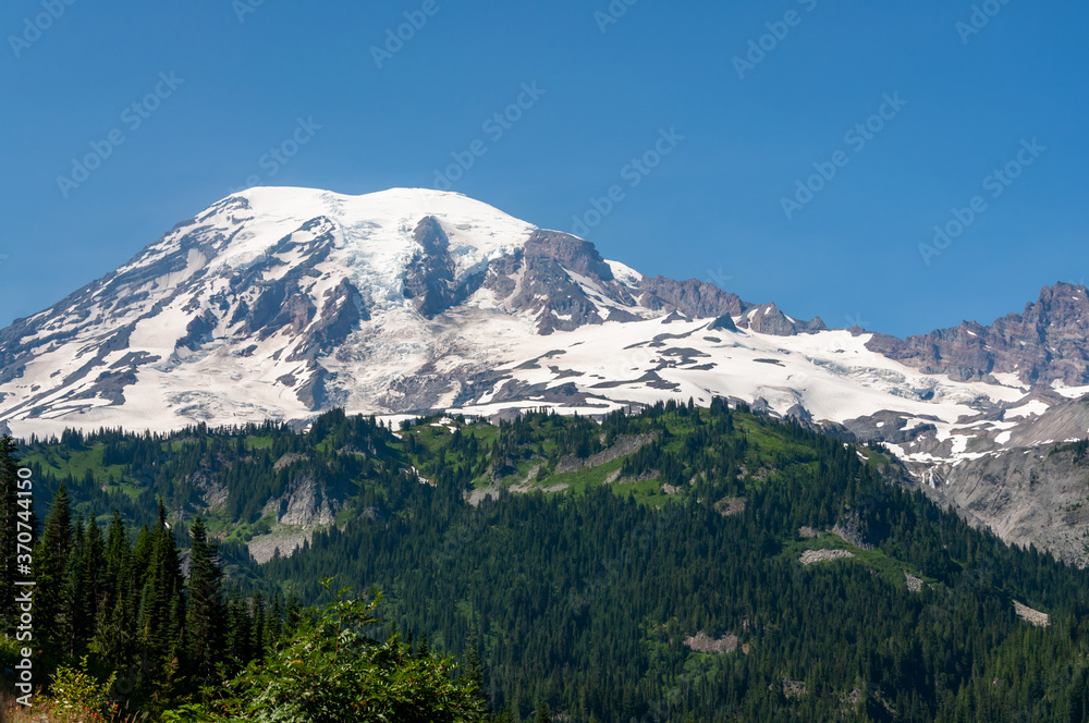 Mount Mt. Rainer Cascade Range Pacific Northwest Washington mountain peak and forest of pine trees
