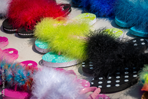 Fuzzy feathered colorful slippers for sale at flea market in Upstate NY © Chet Wiker
