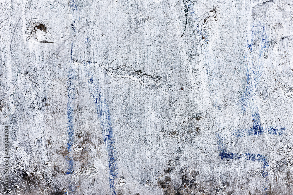 Fototapeta premium Background concrete wall, traces of weathering, worn wall damaged paint old paint. Remains of old paint on the painted concrete surface. Grungy concrete surface.