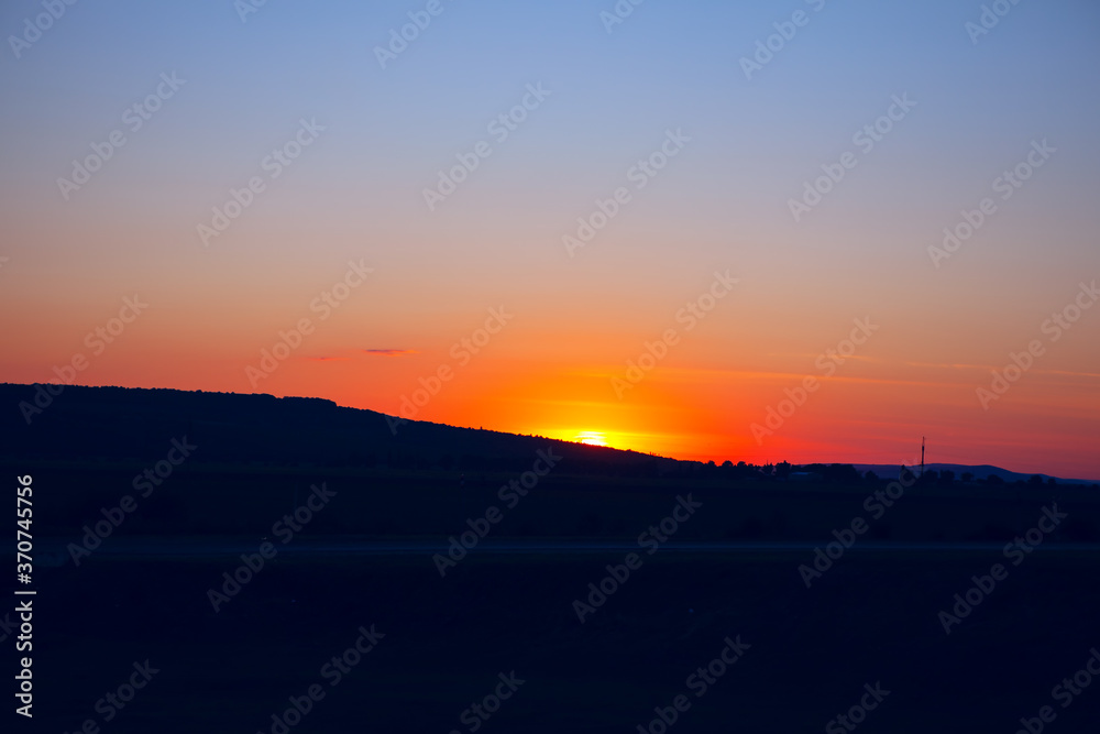 Sunset over the hill . Landscape with sunset Sunset over the hill . Landscape with sunset