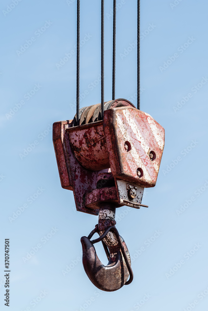 Crane hook against blue sky close up. Russia, Orenburg region Crane hook against blue sky close up. Russia, Orenburg region