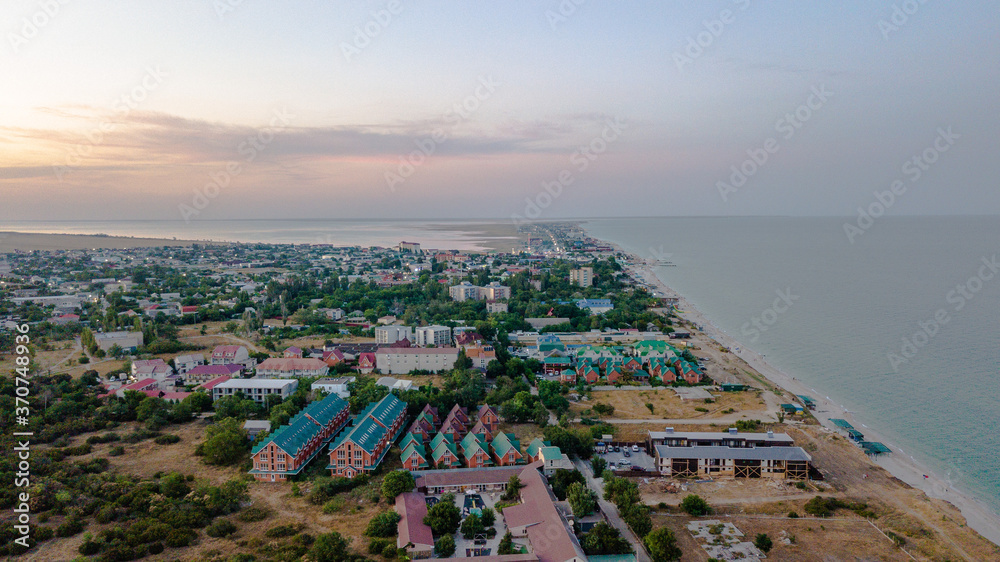 Aerial drone shot of the beach town with beautiful beach and ocean