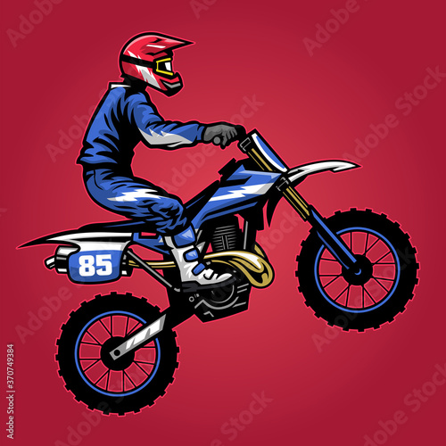 standing motocross rider ride the bike