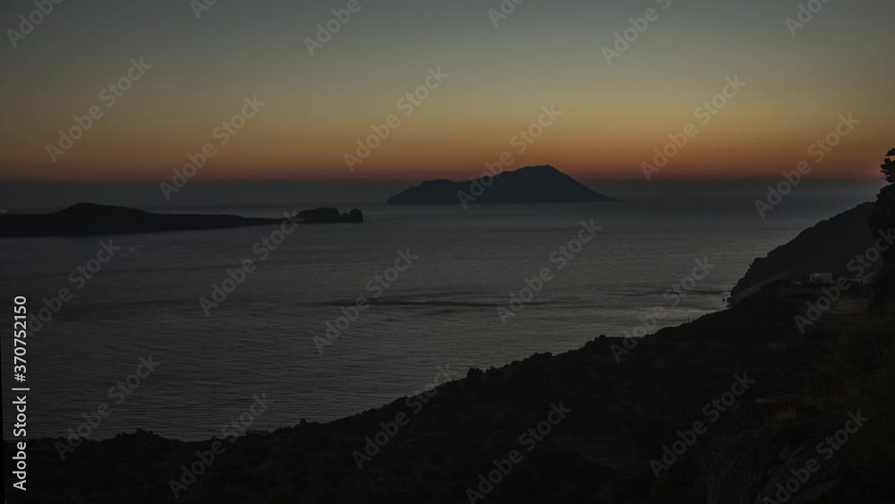 Golden Hour Sunset Time Lapse of Sun disappears in Ocean of Greek Island Milos, Greece