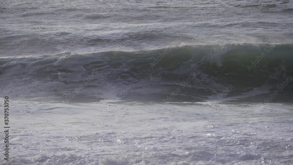 blue waves rushing toward beach slow motion blue waves rushing toward beach slow motion