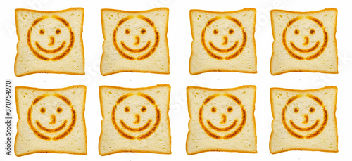 White bread toast with smile on white background