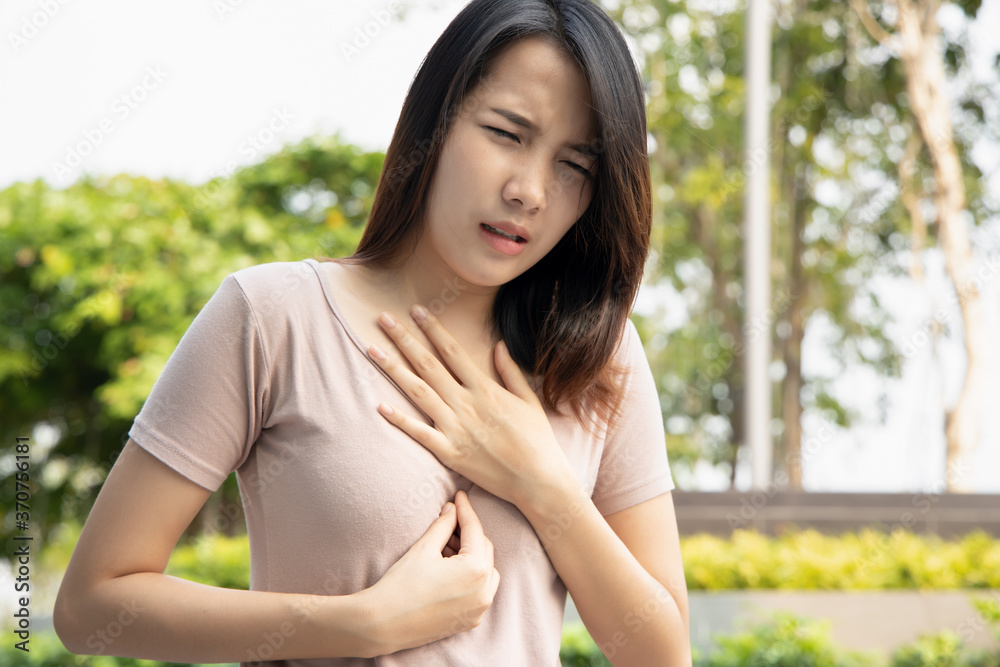 sick woman with indigestion problem, acid reflux or gerd symptoms; woman health care, body care, sickness, pain, acid reflux, pneumonia, virus disease concept; 20s young adult asian woman model sick woman with indigestion problem, acid reflux or gerd symptoms; woman health care, body care, sickness, pain, acid reflux, pneumonia, virus disease concept; 20s young adult asian woman model