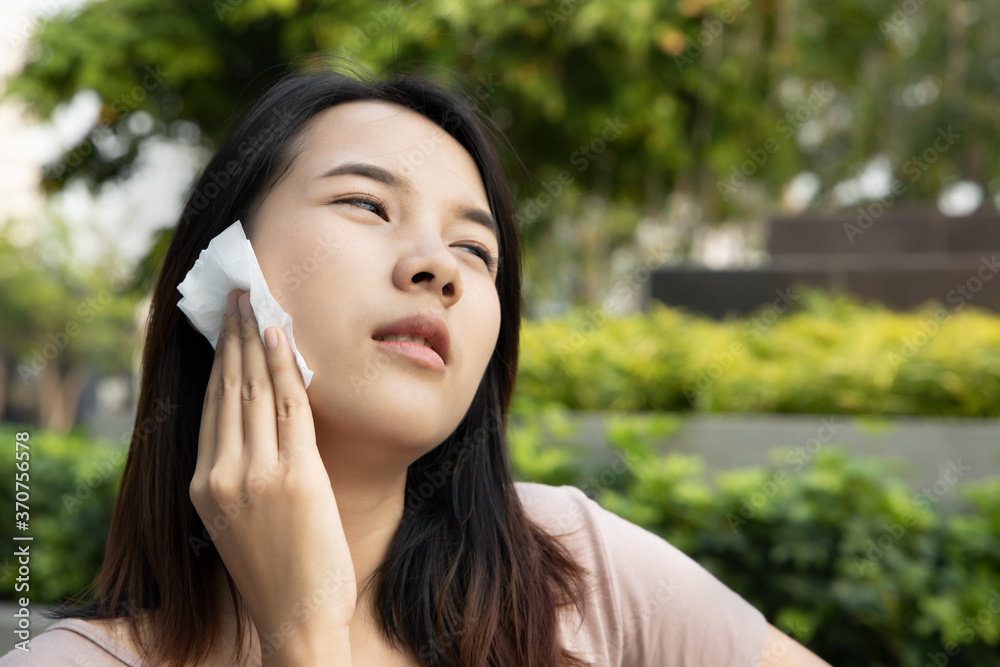 sweating woman in hot summer with tropical high and humid weather