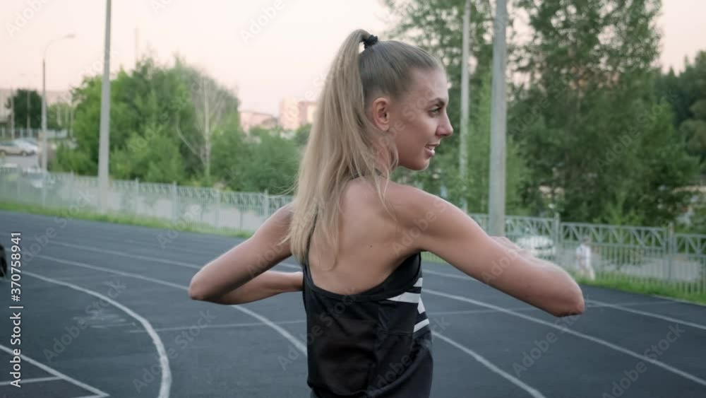 Young motivated woman runner warm up outdoor Young motivated woman runner warm up outdoor