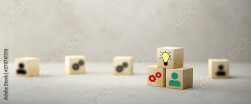 cubes showing a brainstorming session on concrete background