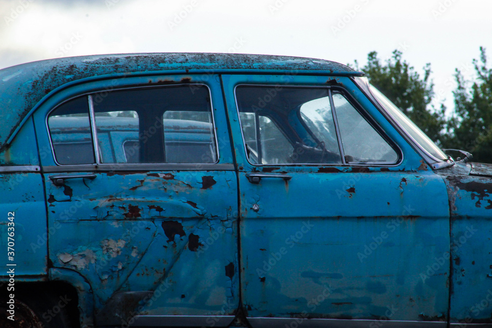 Old Soviet cars in disassembled condition, the body of old rare cars