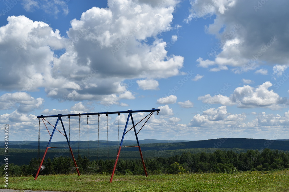Swings in the schoolyard, Sainte-Apolline, Quebec Swings in the schoolyard, Sainte-Apolline, Quebec