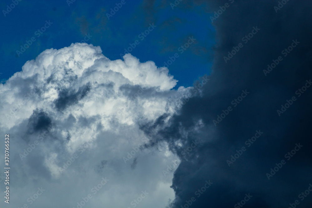 Abstract background of floating clouds. Feathers of clouds in the sky. Beautiful blue sky, bright natural background Abstract background of floating clouds. Feathers of clouds in the sky. Beautiful blue sky, bright natural background