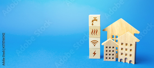 Residential buildings and blocks with communal services symbols. Utilities public service. Price, payment methods, subsidies registration. Savings, reduced environmental impact. Energy saving photo