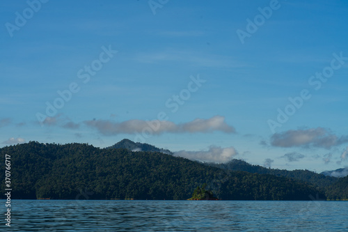 Kenyir lake small islands with beautiful rainforest tropical jungle. Scenic landscape view. Located in Terengganu, Malaysia.