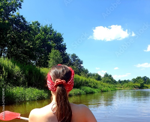 girl paddling on a kayak