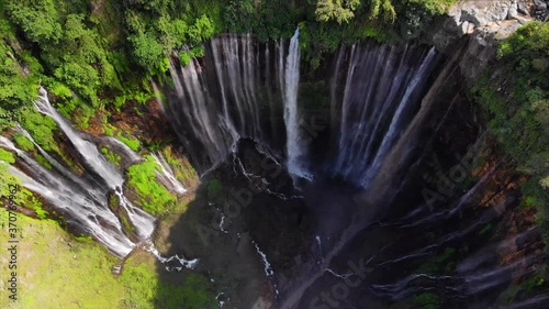 Sewu Waterfall is located between the Pronojiwo District, Lumajang Regency in East Java Indonesia shot from drone photo