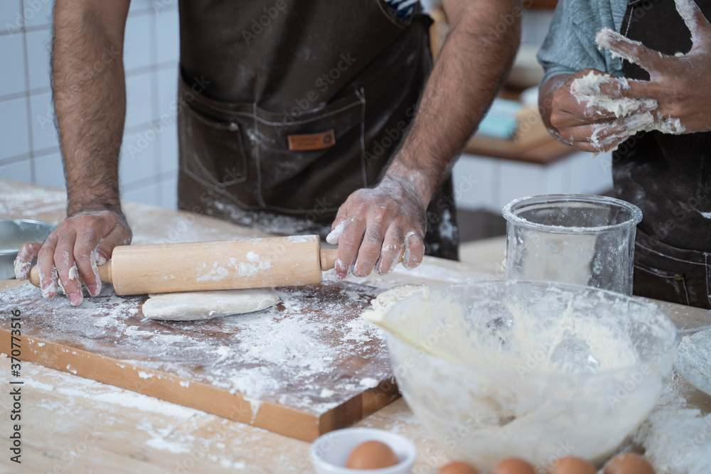 Fototapeta premium Pizza dough preparation by chef.